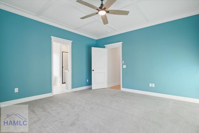 empty room with carpet flooring, ceiling fan, and crown molding