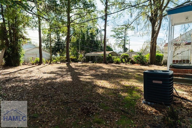 view of yard with central AC