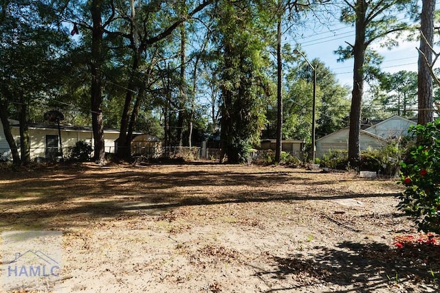 view of yard featuring fence