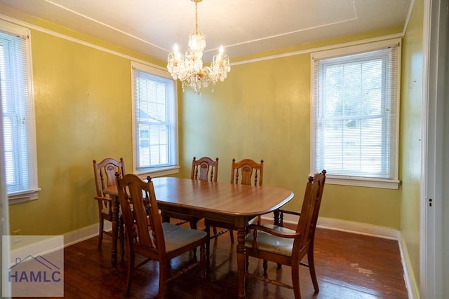 dining area with a healthy amount of sunlight, baseboards, and wood finished floors