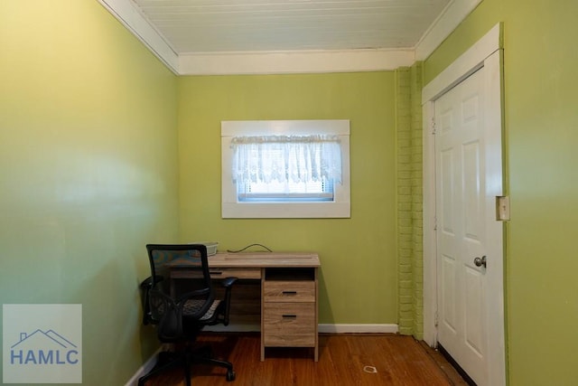 office with dark wood-type flooring, crown molding, and baseboards