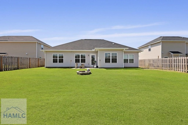 568 Abode Ave, Hinesville, GA 31313 - rear view of property with a fenced backyard and an outdoor fire pit