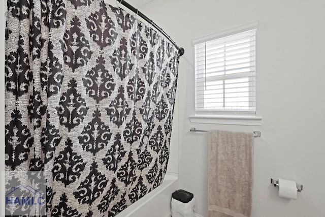 568 Abode Ave, Hinesville, GA 31313 - bathroom with shower / tub combo with curtain and baseboards