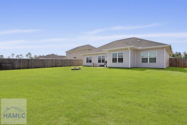 568 Abode Ave, Hinesville, GA 31313 - back of house with a fenced backyard and a fire pit