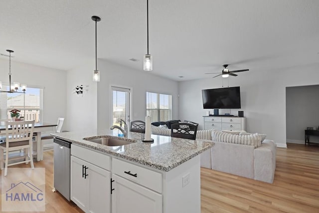 568 Abode Ave, Hinesville, GA 31313 - kitchen with dishwasher, light wood-type flooring, a ceiling fan, and light stone countertops