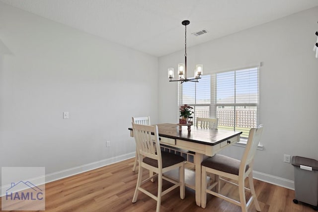 568 Abode Ave, Hinesville, GA 31313 - dining room featuring a chandelier and wood finished floors
