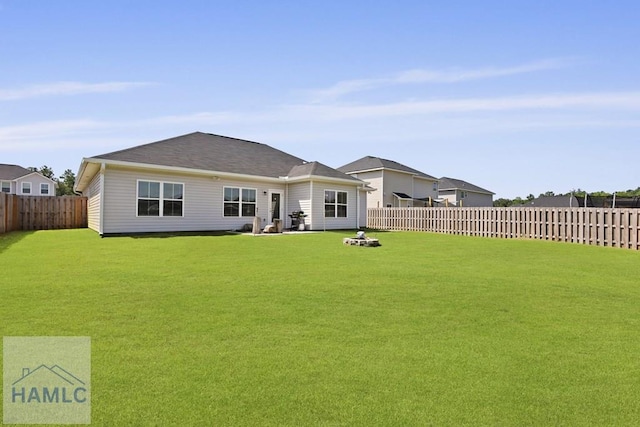 568 Abode Ave, Hinesville, GA 31313 - back of house with a fenced backyard