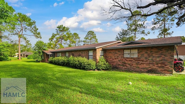 314 Twin Parks Dr, Jesup, GA 31545 - view of side of property featuring brick siding and a lawn