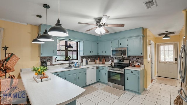314 Twin Parks Dr, Jesup, GA 31545 - kitchen featuring stainless steel appliances, decorative backsplash, healthy amount of natural light, and light countertops