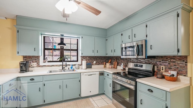 314 Twin Parks Dr, Jesup, GA 31545 - kitchen with appliances with stainless steel finishes, ceiling fan, decorative backsplash, and light countertops
