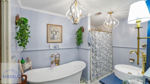 314 Twin Parks Dr, Jesup, GA 31545 - bathroom featuring a chandelier, a wainscoted wall, a freestanding bath, crown molding, and curtained shower