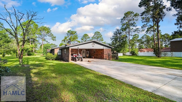 314 Twin Parks Dr, Jesup, GA 31545 - rear view of house with a lawn, driveway, brick siding, and a carport