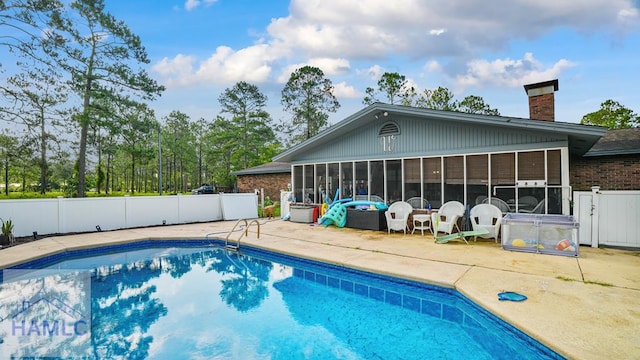 314 Twin Parks Dr, Jesup, GA 31545 - view of swimming pool with a sunroom and a patio