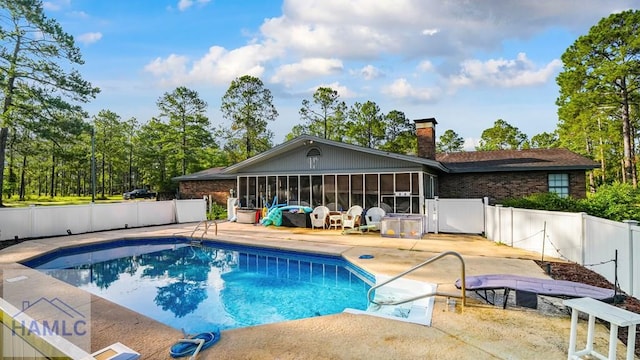 314 Twin Parks Dr, Jesup, GA 31545 - view of swimming pool featuring a sunroom, a patio, and a fenced backyard
