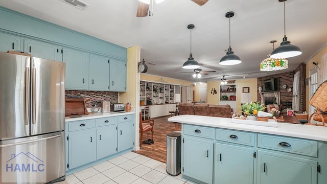 314 Twin Parks Dr, Jesup, GA 31545 - kitchen featuring freestanding refrigerator, ceiling fan, open floor plan, and light tile patterned floors