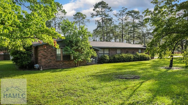 314 Twin Parks Dr, Jesup, GA 31545 - view of front of house with brick siding and a front yard