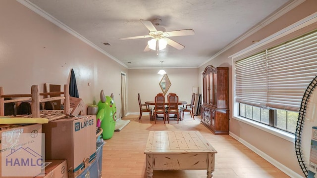 314 Twin Parks Dr, Jesup, GA 31545 - dining room featuring light wood-style flooring, a ceiling fan, and crown molding