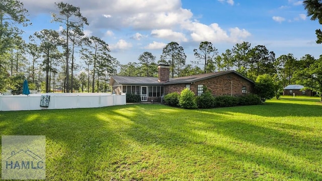 314 Twin Parks Dr, Jesup, GA 31545 - rear view of house with a chimney