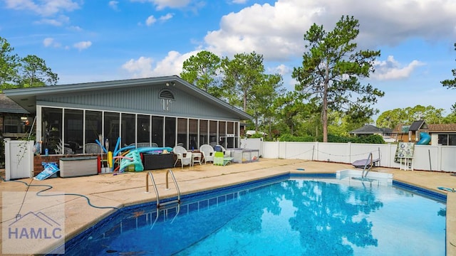 314 Twin Parks Dr, Jesup, GA 31545 - view of pool featuring a sunroom, a patio, and a fenced backyard