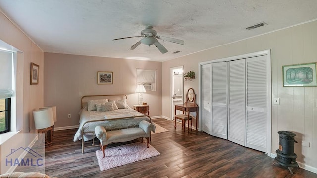 314 Twin Parks Dr, Jesup, GA 31545 - bedroom featuring dark wood-style flooring, a closet, and a ceiling fan