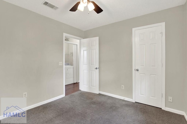 65 W Kenny Dr, Hinesville, GA 31313 - unfurnished bedroom with dark carpet, washer and dryer, and ceiling fan