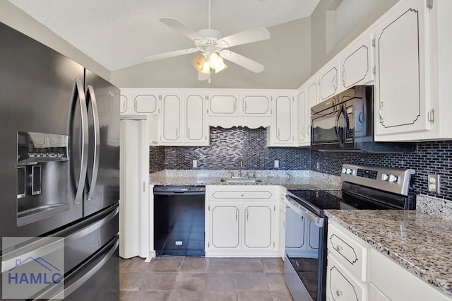 65 W Kenny Dr, Hinesville, GA 31313 - kitchen featuring black appliances, tasteful backsplash, tile patterned flooring, white cabinetry, and vaulted ceiling