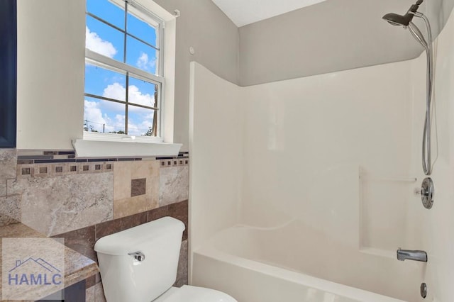 65 W Kenny Dr, Hinesville, GA 31313 - bathroom featuring shower / bathtub combination and tile walls