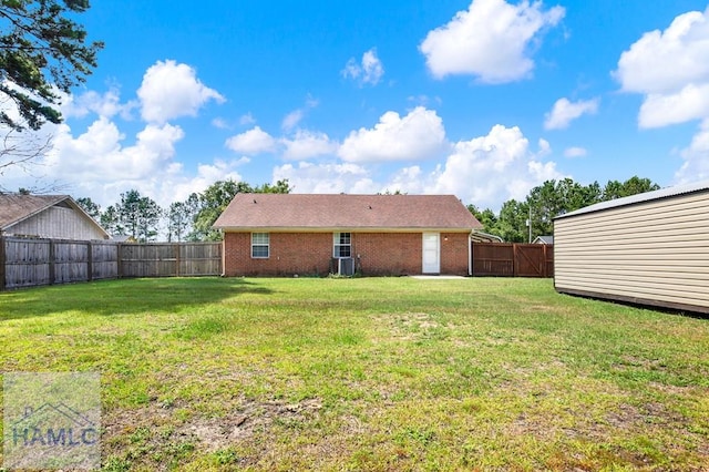 65 W Kenny Dr, Hinesville, GA 31313 - back of property featuring brick siding and a fenced backyard