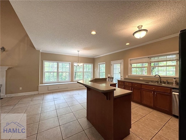 440 Arnold River Rd, Jesup, GA 31545 - kitchen featuring a textured ceiling, healthy amount of natural light, crown molding, light tile patterned floors, and a kitchen bar