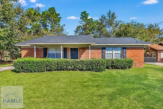 ranch-style home with a front yard