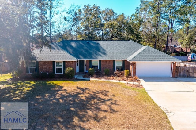 ranch-style house with a front lawn and a garage