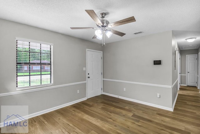 197 Sequoia Cir, Hinesville, GA 31313 - empty room with wood finished floors, baseboards, a ceiling fan, and visible vents