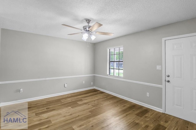 197 Sequoia Cir, Hinesville, GA 31313 - spare room with a textured ceiling, baseboards, a ceiling fan, and wood finished floors