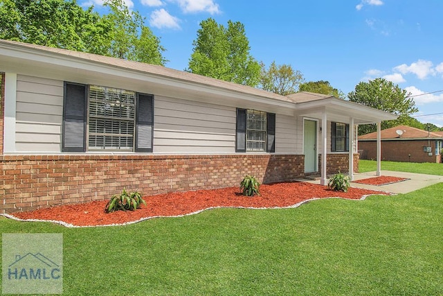 197 Sequoia Cir, Hinesville, GA 31313 - ranch-style home with a front lawn and brick siding