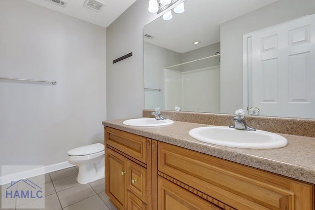 bathroom with walk in shower, tile patterned floors, toilet, and vanity