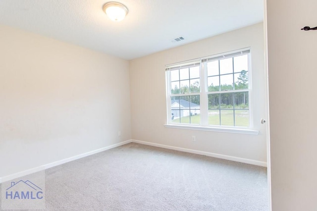 unfurnished room featuring carpet