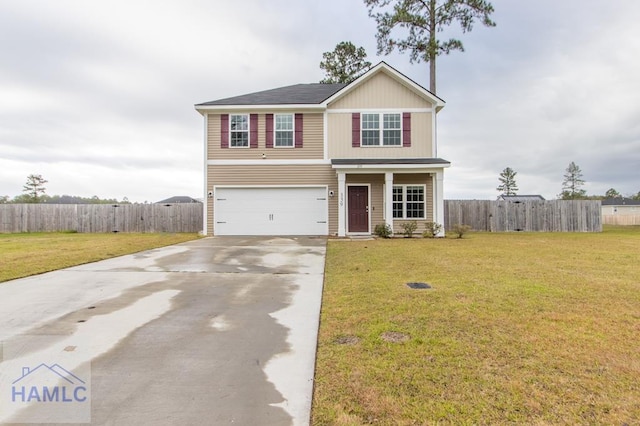 view of front of house featuring a front yard and a garage