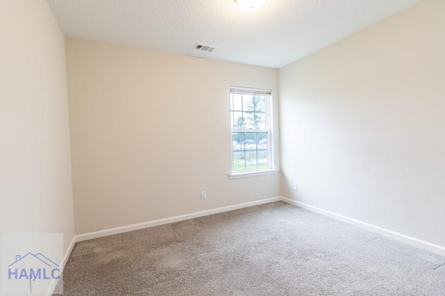 unfurnished room featuring carpet flooring