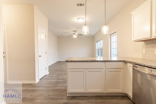 kitchen featuring ceiling fan, dark hardwood / wood-style flooring, white cabinets, and stainless steel dishwasher