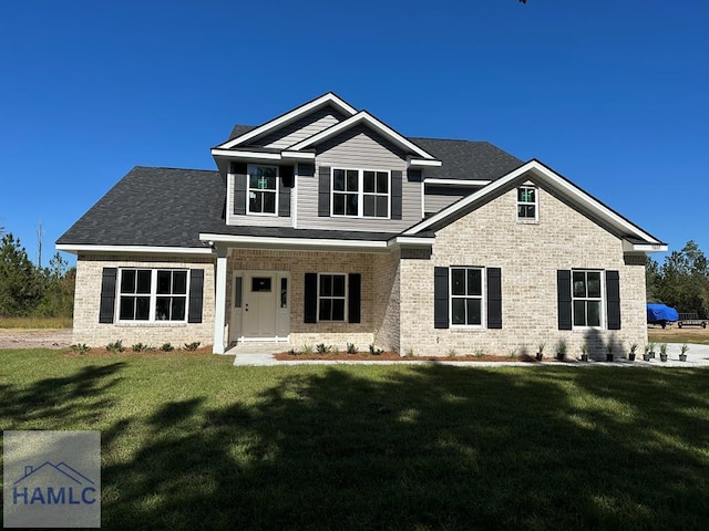 craftsman-style home with a front yard