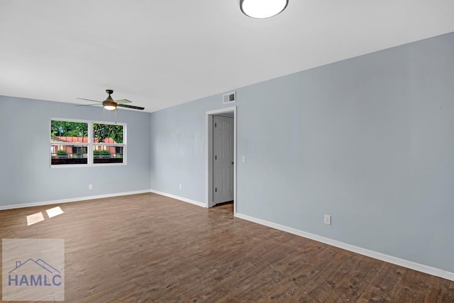 654 Mcdowell Rd, Hinesville, GA 31313 - empty room featuring a ceiling fan, dark wood-style floors, and baseboards