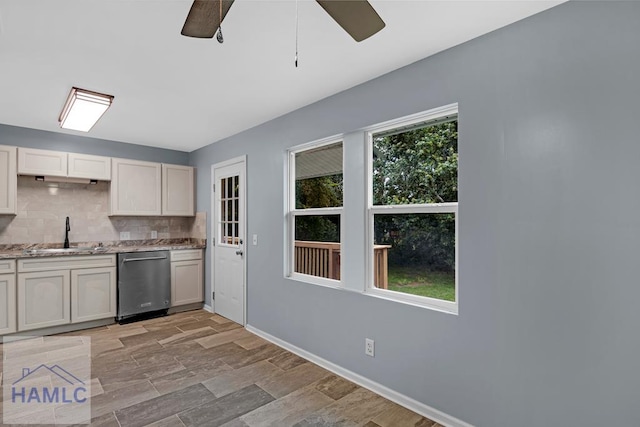 654 Mcdowell Rd, Hinesville, GA 31313 - kitchen featuring stainless steel dishwasher, a sink, ceiling fan, decorative backsplash, and baseboards