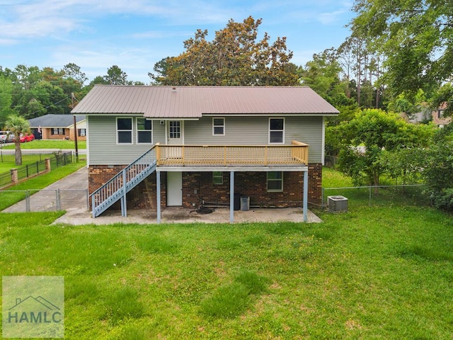 654 Mcdowell Rd, Hinesville, GA 31313 - rear view of house with cooling unit, a patio, stairs, and metal roof