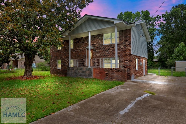 654 Mcdowell Rd, Hinesville, GA 31313 - view of front of home featuring covered porch, driveway, and brick siding