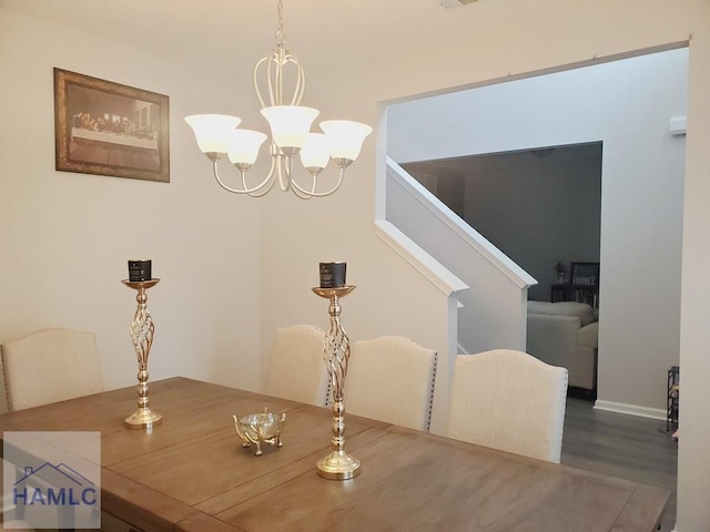 dining room featuring hardwood / wood-style floors and a notable chandelier