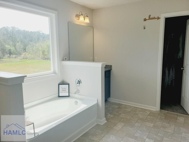 bathroom featuring a tub to relax in