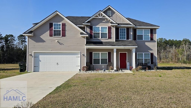 view of front of home featuring a garage and a front yard