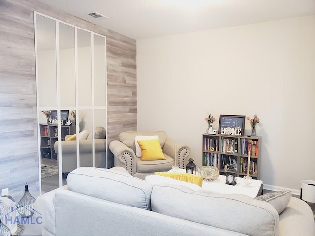 living room with wood walls