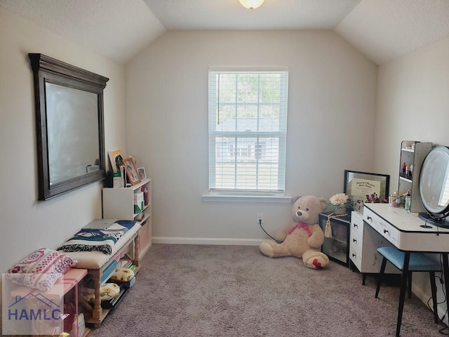 interior space with lofted ceiling, carpet, and plenty of natural light