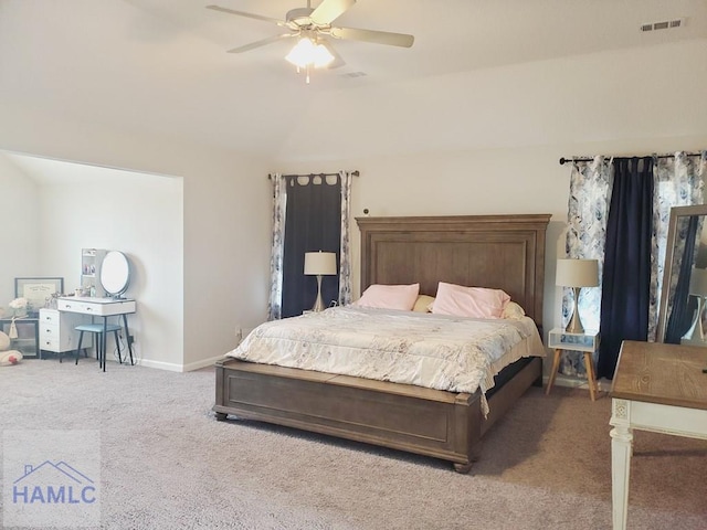 bedroom featuring ceiling fan, carpet floors, and vaulted ceiling